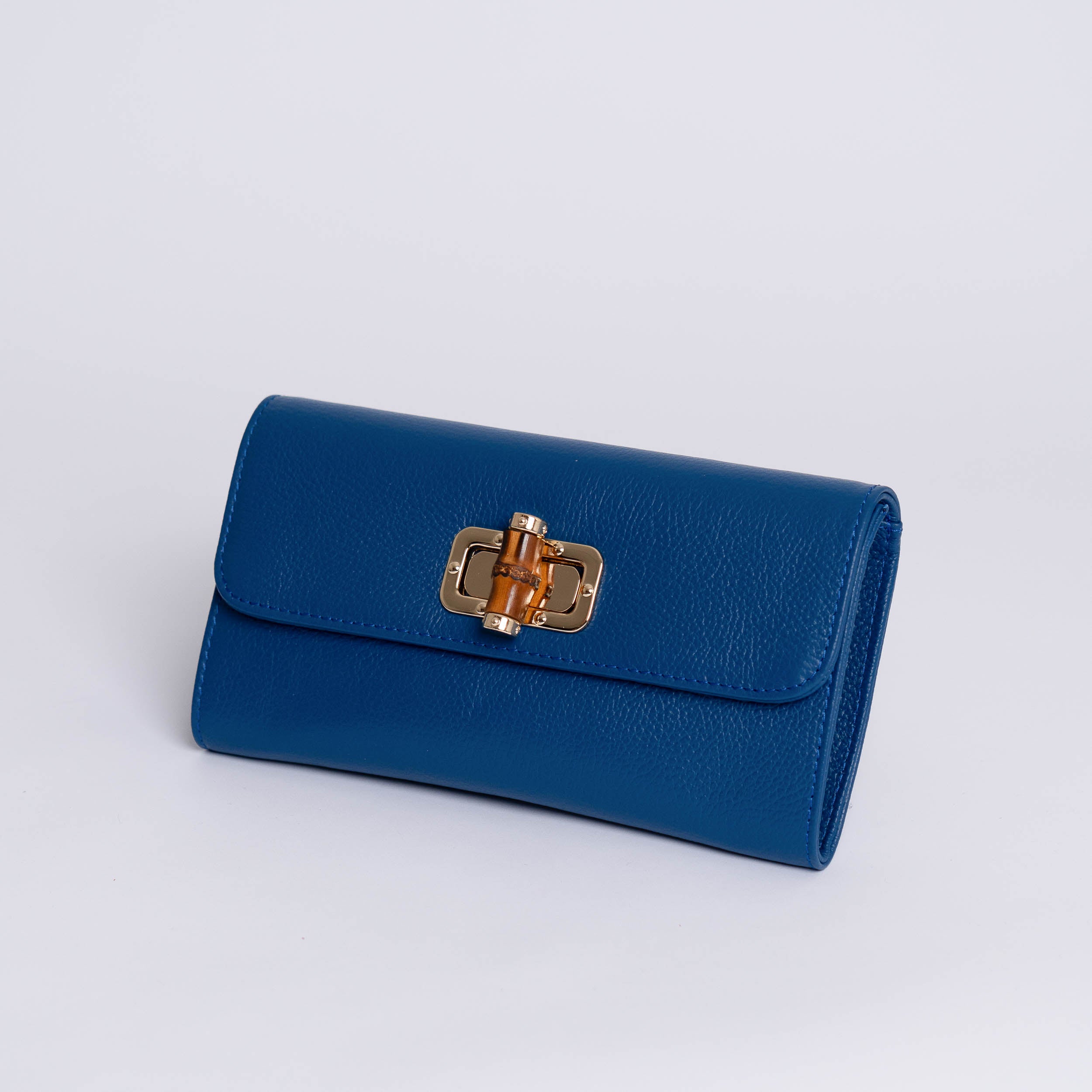 Stilig og praktisk crossbody/clutch veske i blått skinn